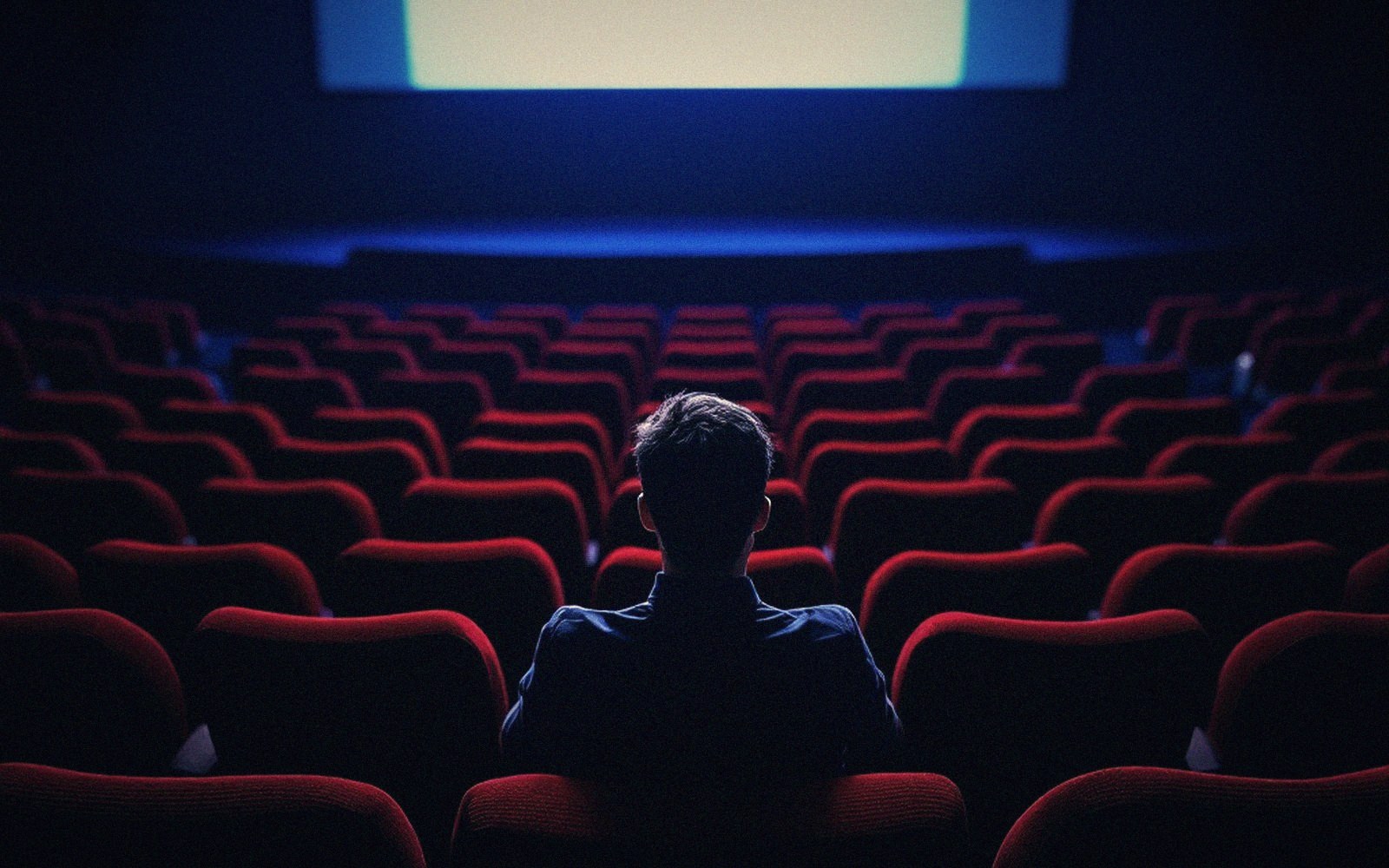 Someone alone in a row, watching